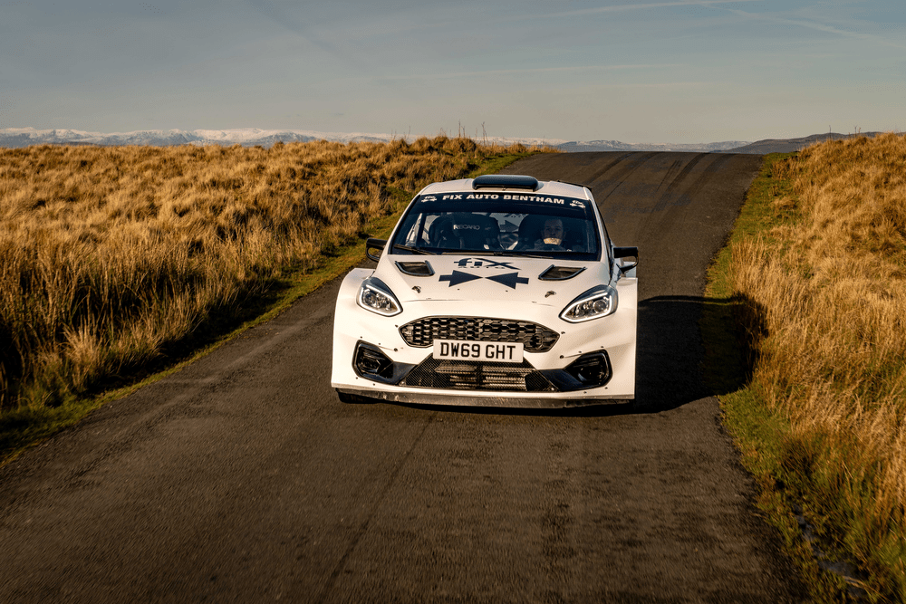 Fiesta Rally2 car following the camera closely with driver clearly visible.